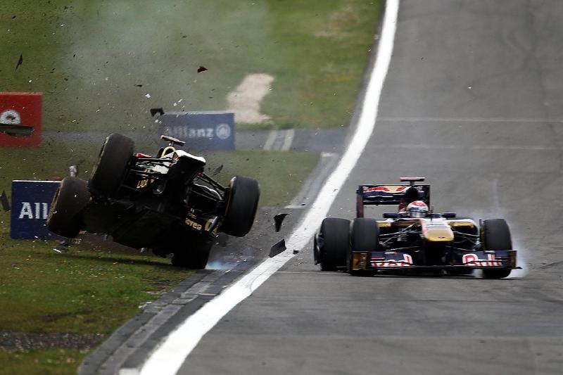 Nick Heidfeld (GER) Lotus Renault GP R31 crashed out of the race after contact with Sebastien Buemi (SUI) Scuderia Toro Rosso STR6. Formula One World Championship, Rd 10,German Grand Prix, Race, Nurburgring, Germany, Sunday, 24 July 2011