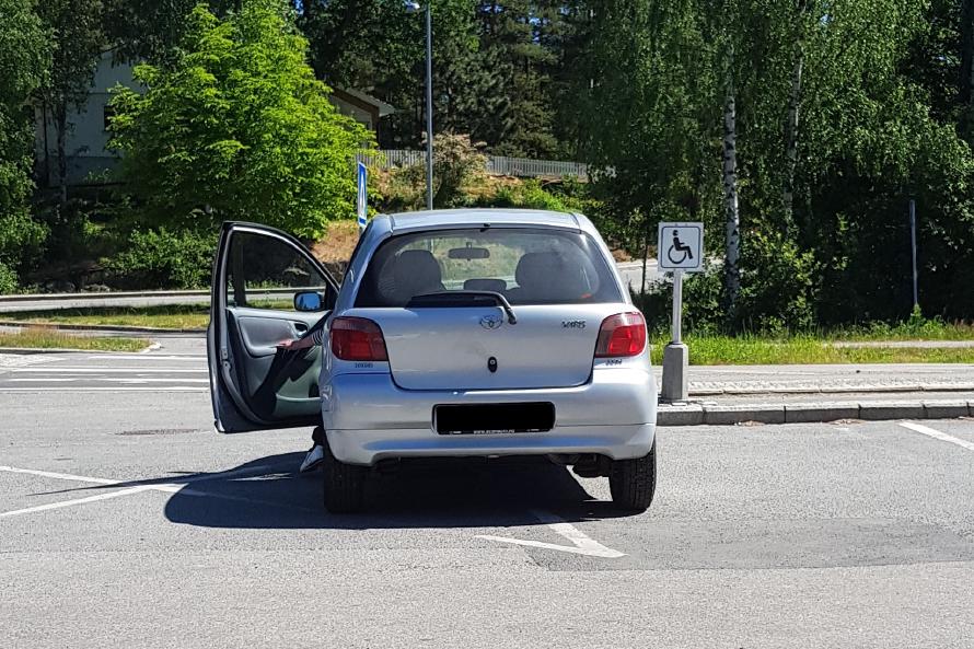 Half the car is on a handicap spot he’s not allowed to park on, while the other half is parked in a no parking zone.