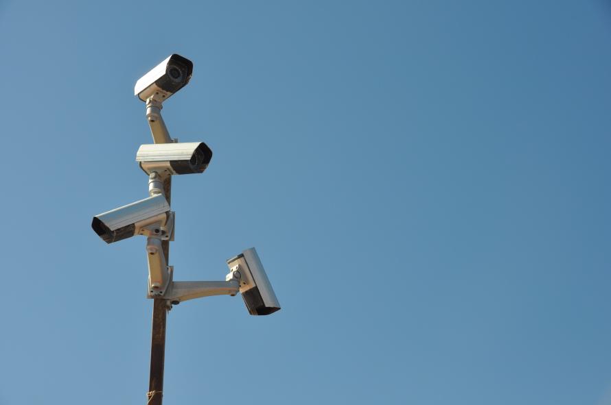 Four surveillance cameras facing in different directions.