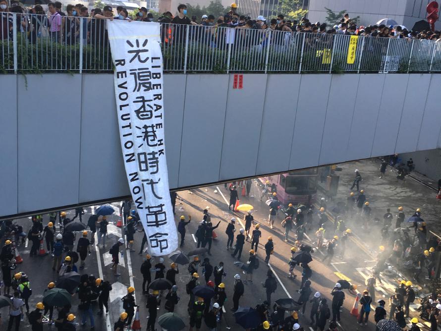 The "Liberate Hong Kong, revolution of our age!" slogan displayed in August 2019 from a footbridge over Harcourt Road in Admiralty.