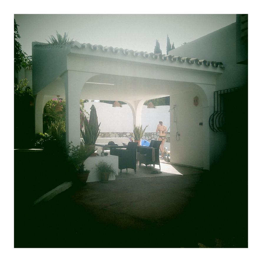 The porch with The Hottie in the background by the pool.