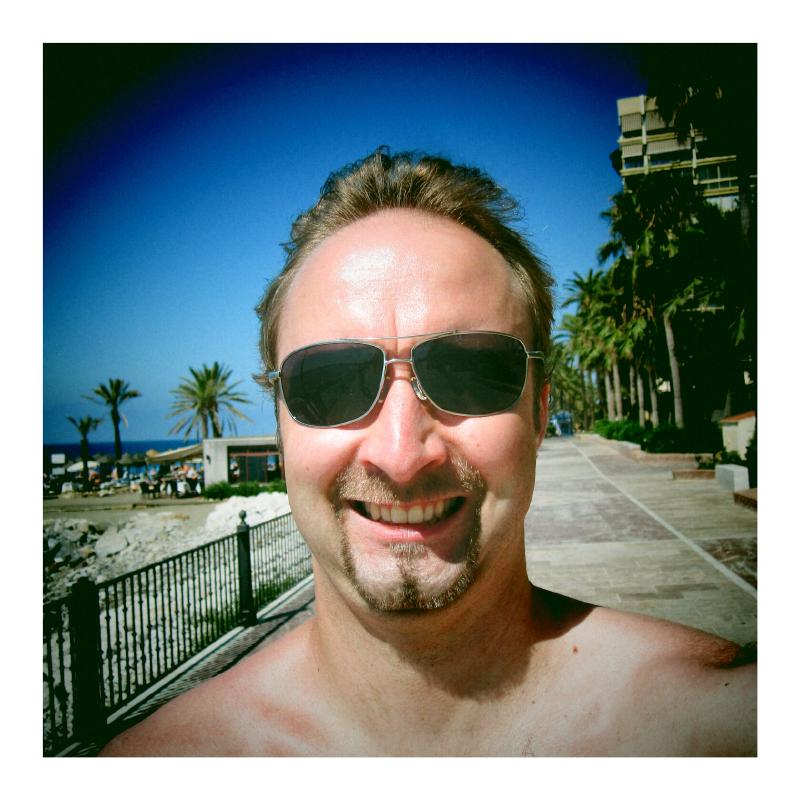 Yours truly on a bike going from Puerto Banús to Marbella. My smile is as natural as it gets when I have a camera pointed at me.