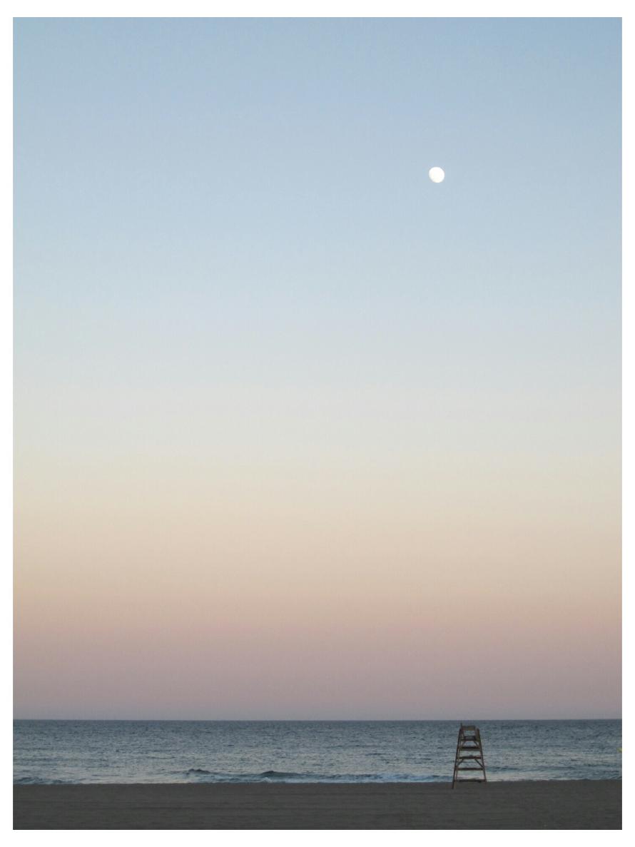 Sunset and the moon at Aurora Beach.