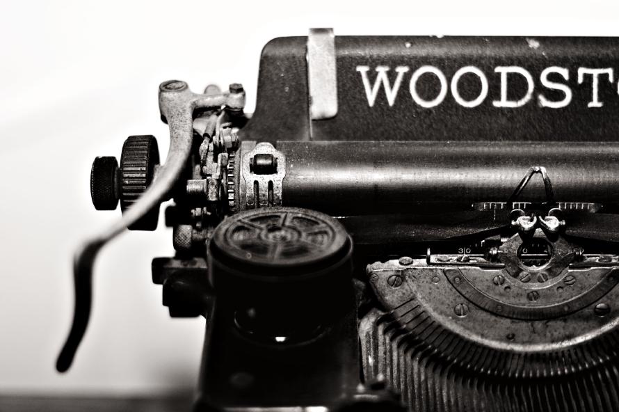 Gutenberg: A black & white closeup of a typewriter.