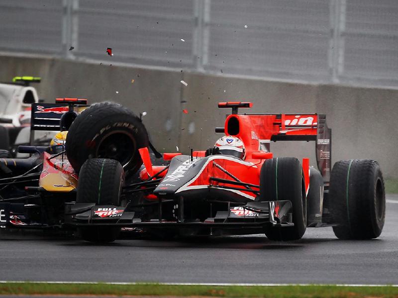 Sebastien Buemi (SUI) Scuderia Toro Rosso STR5 and Timo Glock (GER) Virgin Racing VR-01 collide. Formula One World Championship, Rd 17, Korean Grand Prix, Race, Korea International Circuit, Yeongam, South Korea, Sunday, 24 October 2010