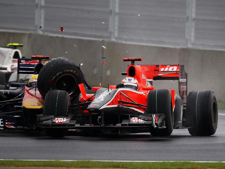 Sebastien Buemi (SUI) Scuderia Toro Rosso STR5 and Timo Glock (GER) Virgin Racing VR-01 collide. Formula One World Championship, Rd 17, Korean Grand Prix, Race, Korea International Circuit, Yeongam, South Korea, Sunday, 24 October 2010