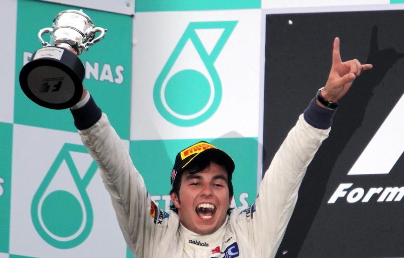 Second placed Sergio Perez (MEX) Sauber celebrates on the podium. Formula One World Championship, Rd2, Malaysian Grand Prix, Race, Sepang, Malaysia, Sunday, 25 March 2012. © Sutton Images. No reproduction without permission.