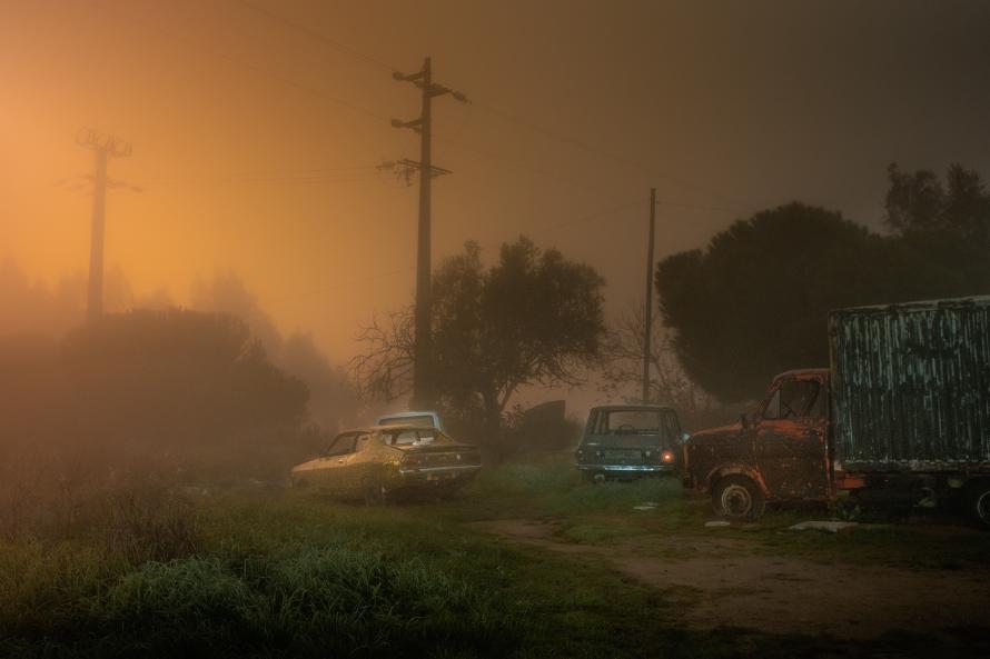 A group of old, parked cars.