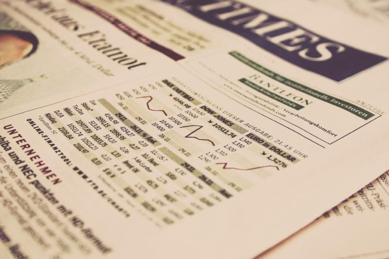 The front page of a The Financial Times Newspaper showing stock market information.