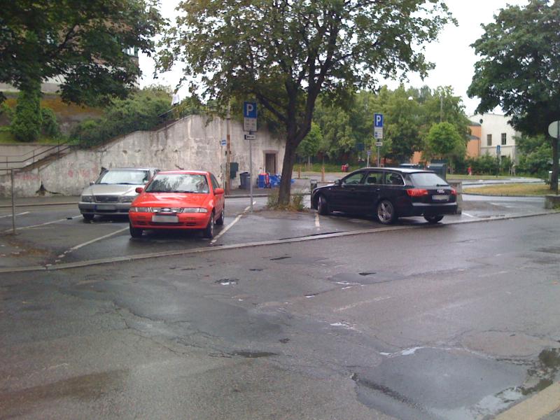 A double parked car.