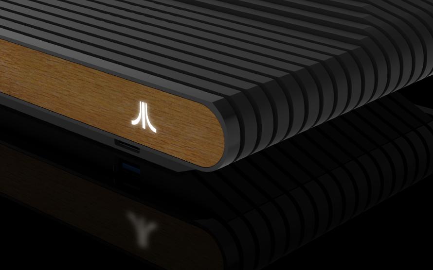 A computer generated image of the front of the Atari VCS with a white, glowing Atari logo.